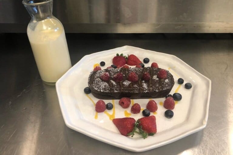 paul's fantasia dessert brownie with fresh strawberries and raspberries