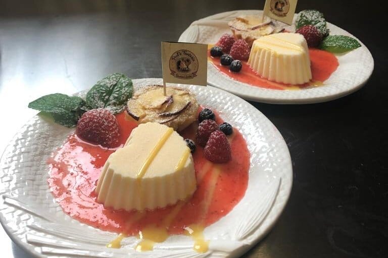 paul's fantasia dessert panna cotta with strawberry sauce and fresh fruits with mint